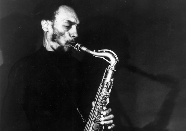 Sam Rivers playing a baritone saxophone